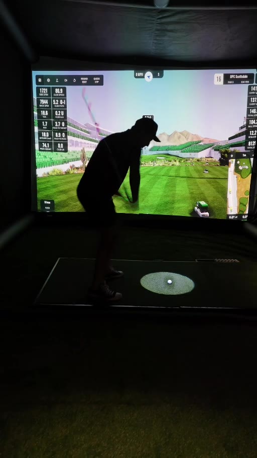 A guest takes a swing at an evening Mobile Tee event